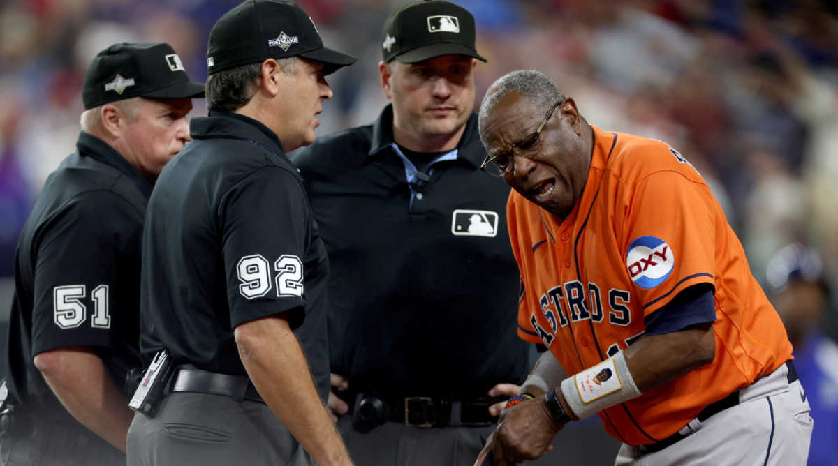 Astros manager Dusty Baker argues with umpires after Rangers right fielder Adolis Garcia (not pictured) was hit by a pitch and Astros pitcher Bryan Abreu (not pictured) was ejected during the eighth inning of game five in the ALCS for the 2023 MLB playoffs at Globe Life Field.